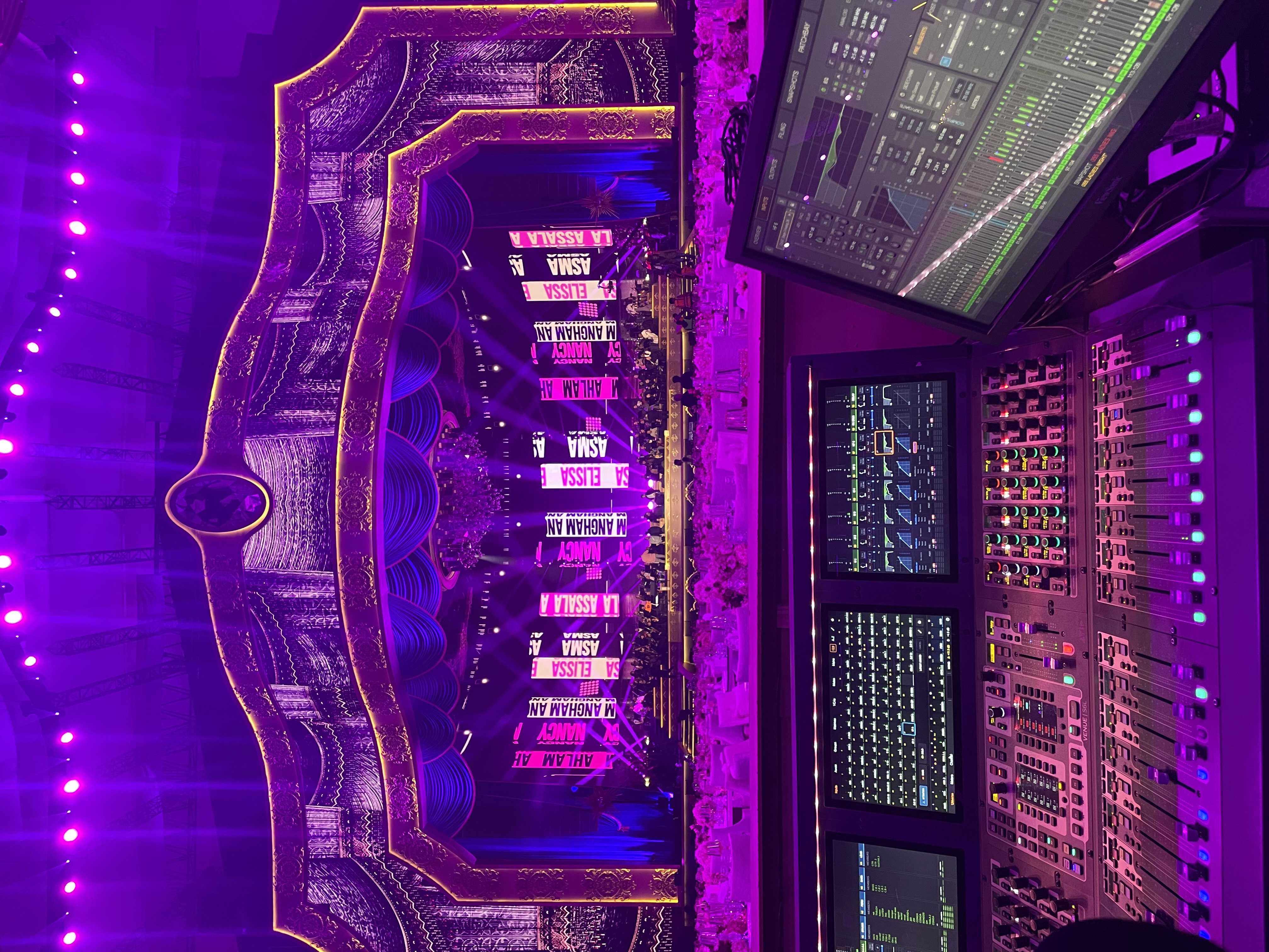 FOH setup in purple-lit ornate venue